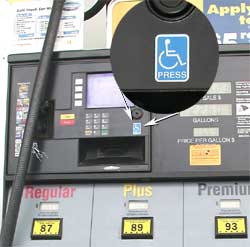 hoto - close up of button on gas pump with access symbol