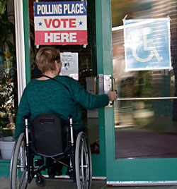 picture of person using a wheelchair entering polling place